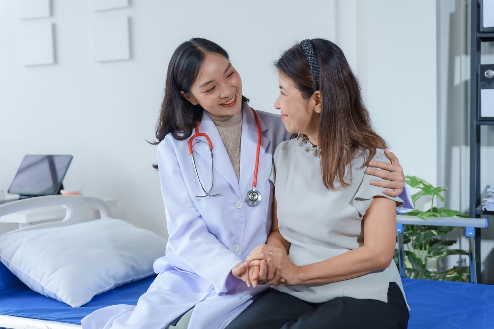 A doctor comforting a patient after post-op recovery